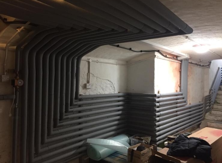 Sleeved copper pipework installation