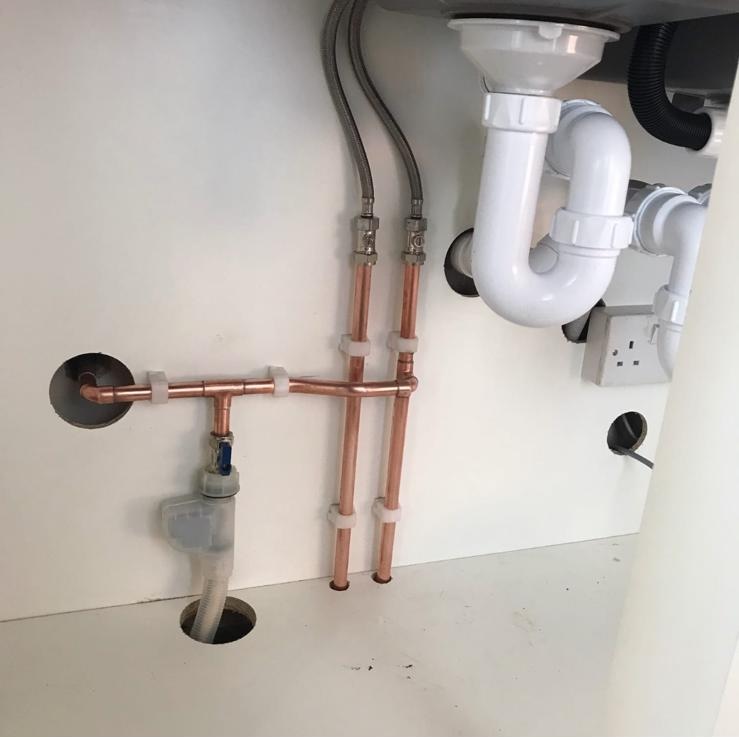 Tidy under-sink supply and waste plumbing